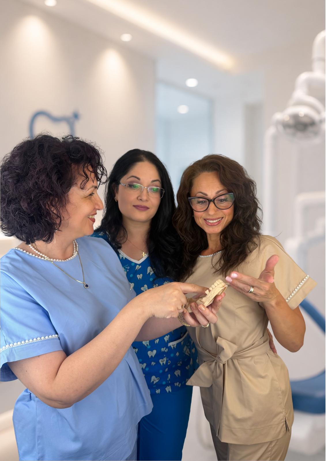 Echipa B.P. Dental Office discutând cu grijă despre tratament